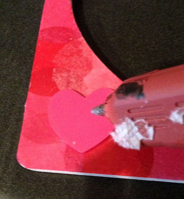 Using hot glue on the back of a wood heart shape