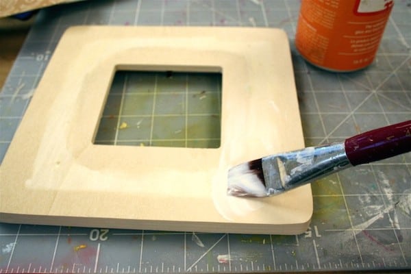 Adding Mod Podge to the front of a frame