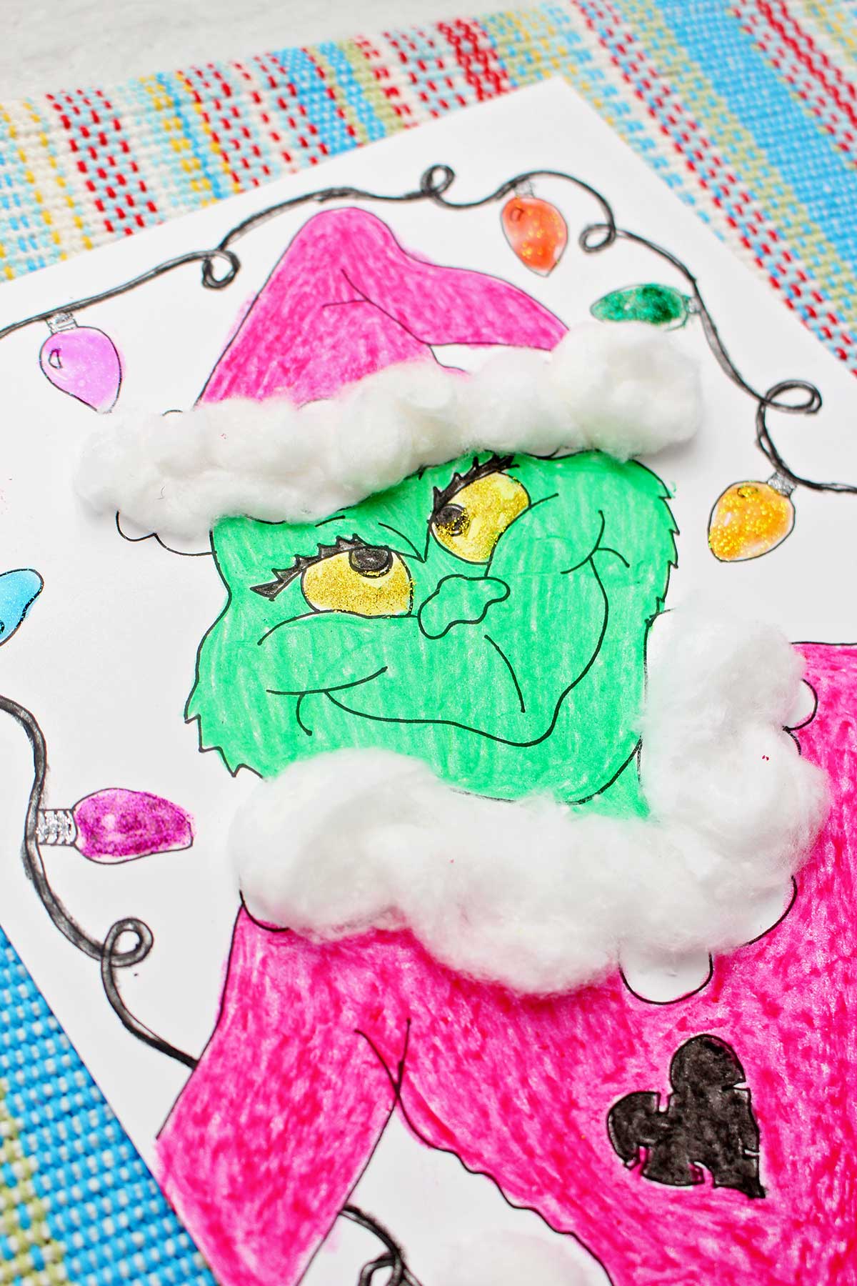 Close up of a completed Grinch coloring page.