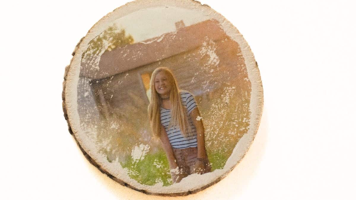 Photo transferred onto a wood slice using a DIY image transfer technique for handmade gifts and home decor.