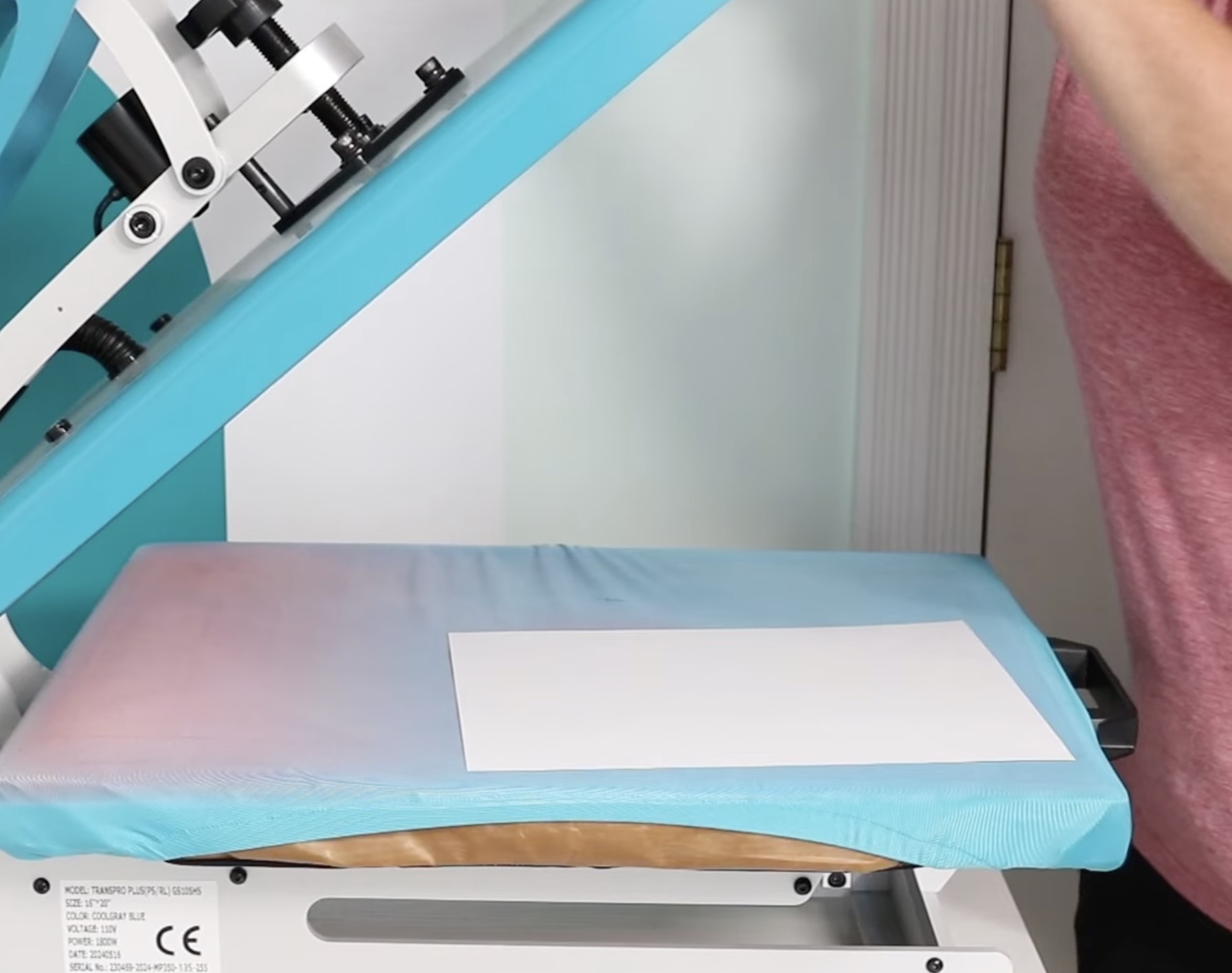 Add copy paper to the heat press.