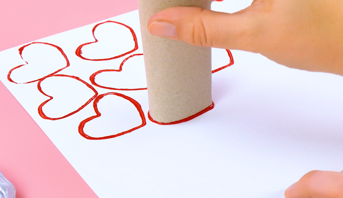 Red hearts on cardboard