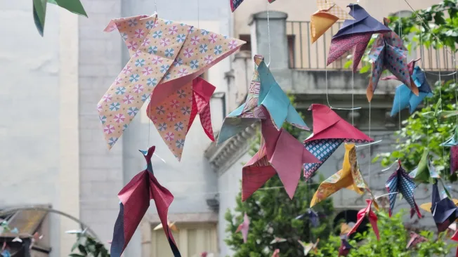 Origami birds on the clothesline.