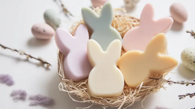Cute Easter bunny soap in different colors in an Easter basket.